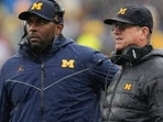 Sherrone Moore, left, and Jim Harbaugh (AP Photo/Paul Sancya) Sherrone Moore, left, and Jim Harbaugh (AP Photo/Paul Sancya)
