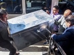 Guwahati: Special Investigation Team (SIT) officials carrying a trunk that contains statements from nearly 300 individuals related to the Zubeen Garg death case arrive at a court, in Guwahati. (PTI Photo)