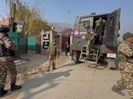 Security personnel during a verification drive across hotels and lodging establishments after a Chinese national Hu Congtai was detained for entering Ladakh and Jammu and Kashmir in violation of his visa stipulations, at Pahalgam, in Anantnag district on Thursday. (PTI)