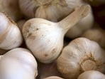 Eating garlic may help control cholesterol levels. However, you should use it in moderation and not as a replacement for medication.