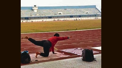 An athlete warming up during a practice session at Guru Nanak Stadium in Ludhiana. Authorities aim to upgrade the stadium’s lighting to international standards for day-night events. (Gurpreet Singh/HT) An athlete warming up during a practice session at Guru Nanak Stadium in Ludhiana. Authorities aim to upgrade the stadium’s lighting to international standards for day-night events. (Gurpreet Singh/HT)