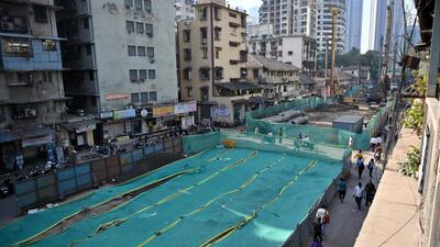 At the Elphinstone Bridge demolition site, the debris has been covered with green sheets to avoid dust particles from spreading. (Raju Shinde/HT Photo) At the Elphinstone Bridge demolition site, the debris has been covered with green sheets to avoid dust particles from spreading. (Raju Shinde/HT Photo)