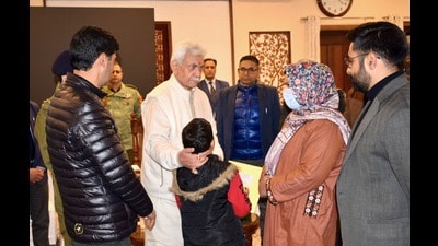 J&K LG Manoj Sinha with family of one of the victims in Nowgam on Friday. (Sourced) J&K LG Manoj Sinha with family of one of the victims in Nowgam on Friday. (Sourced)