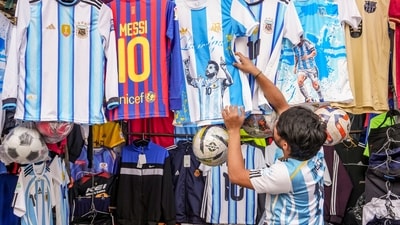 Excited fans are seen buying merch ahead of Messi's much-anticipated arrival in Kolkata. (PTI Photo/Manvender Vashist Lav) Excited fans are seen buying merch ahead of Messi's much-anticipated arrival in Kolkata. (PTI Photo/Manvender Vashist Lav)