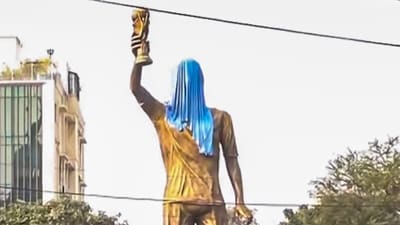 The city is welcoming him with a 70-foot statue, capturing one of the iconic moments when he lifted the World Cup trophy in 2022. It is currently partially covered and will be unveiled soon. (PTI) The city is welcoming him with a 70-foot statue, capturing one of the iconic moments when he lifted the World Cup trophy in 2022. It is currently partially covered and will be unveiled soon. (PTI)