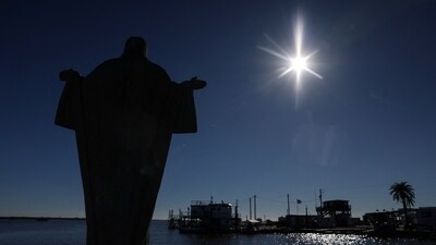 A statue of Jesus stands over the fishing piers of Pointe-aux-Chenes, home to the Pointe-au-Chien Native American tribe, along the Gulf Coast in Louisiana, U.S., December 11, 2025. REUTERS/Shannon Stapleton (REUTERS)