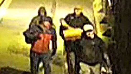 CCTV footage released by the UK's Avon and Somerset Police on December 11, 2025, shows men carrying bags in the early hours of September 25 in the city of Bristol, south-west England, outside a building which housed items from the Bristol museum's British Empire and Commonwealth collection. (Photo: Avon and Somerset Police/AFP)