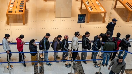 People wait in a queue ahead of the inauguration of the new Apple store, in Noida Sector 18, Gautam Buddh Nagar on Thursday.(PTI)