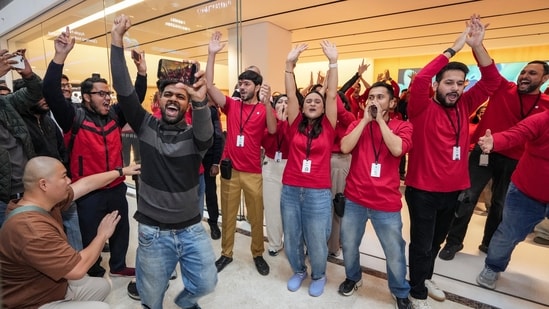Noida: Staff members and customers celebrate during the launch of Apple's new store, in Noida on December 11.(PTI)