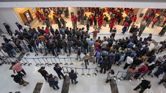 Customers line up during the launch of Apple's new store in Noida on Thursday.(PTI)