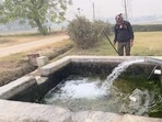 A farmer using ground water for irrigation purposes in Ludhiana on Saturday (Gurpreet Singh/HT) A farmer using ground water for irrigation purposes in Ludhiana on Saturday (Gurpreet Singh/HT)