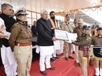 CM Nitish Kumar hands over certificate of recognition to new police cadets in Rajgir on Saturday. (HT Photo)