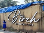 A woman walks past the Birch by Romeo Lane nightclub, which has been sealed for investigation following a fire that killed 25 people in Goa.