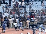 Riot police and fans are seen on the pitch after Argentine soccer star Lionel Messi left Salt lake Stadium in Kolkata on Saturday.