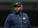 Sherrone Moore of the Michigan Wolverines looks on prior to the game against the Northwestern Wildcats at Wrigley Field Sherrone Moore of the Michigan Wolverines looks on prior to the game against the Northwestern Wildcats at Wrigley Field