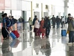 Stranded passengers taking inquiry about flights at Jaiprakash Narayan Airport in Patna amid widespread Indigo flights disruptions on Saturday. (Santosh Kumar/HT)