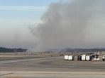 Visuals showed smoke billowing from near a runway at the Dulles airport.