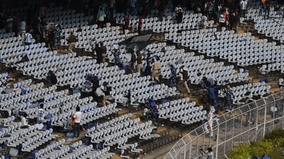 The Kolkata police tried their best to try and bring the situation under control but the fans' anger knew no bounds and they made their displeasure known by hurling whatever they could find inside the stadium. (HT Photo ) The Kolkata police tried their best to try and bring the situation under control but the fans' anger knew no bounds and they made their displeasure known by hurling whatever they could find inside the stadium. (HT Photo )