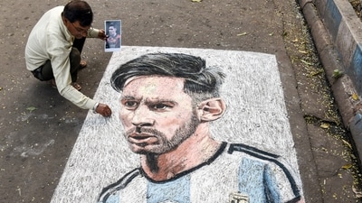 An artist paints a street graffiti of Argentina footballer Lionel Messi, in Kolkata on Friday. (Saikat Paul) An artist paints a street graffiti of Argentina footballer Lionel Messi, in Kolkata on Friday. (Saikat Paul)