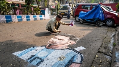Artist Swapan Kumar Das draws a portrait of Argentine footballer and 2022 FIFA World Cup winning captain Lionel Messi ahead of his visit, in Kolkata, West Bengal, (PTI) Artist Swapan Kumar Das draws a portrait of Argentine footballer and 2022 FIFA World Cup winning captain Lionel Messi ahead of his visit, in Kolkata, West Bengal, (PTI)