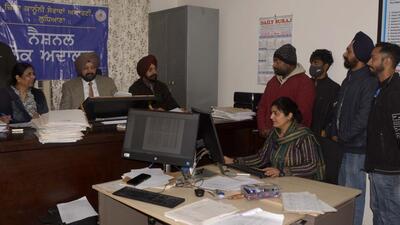 The National Lok Adalat in progress in Ludhiana on Saturday. (Manish/HT)