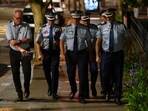 Police officers arrive at St Vincent's Hospital following a shooting incident at Bondi Beach, in Sydney, Australia, December 15, 2025.