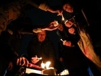 Providence and Brown University community members gather at Lippitt Memorial Park on the East Side a day after a shooting occurred on Brown University campus.