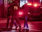 Emergency personnel gather on Waterman Street at Brown University in Providence, R.I., on Saturday, Dec. 13, 2025, during the investigation of a shooting. Emergency personnel gather on Waterman Street at Brown University in Providence, R.I., on Saturday, Dec. 13, 2025, during the investigation of a shooting.