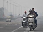 Commuters make their way through dense fog in Ludhiana on Saturday morning. (Gurpreet Singh/HT) Commuters make their way through dense fog in Ludhiana on Saturday morning. (Gurpreet Singh/HT)
