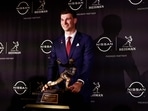 Fernando Mendoza of the Indiana Hoosiers poses with the Heisman Memorial Trophy 