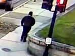 A monitor shows security camera footage of what police say is the Brown University shooting suspect walking along Hope Street after leaving the scene of shooting, in this screengrab taken from a handout video released December 13, 2025. (Providence Public Information Officer/Handout via REUTERS)