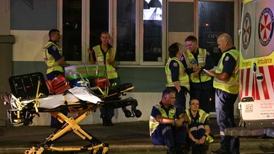 Health workers wait on a street after a shooting incident at Bondi Beach in Sydney on December 14, 2025. (AFP) Health workers wait on a street after a shooting incident at Bondi Beach in Sydney on December 14, 2025. (AFP)