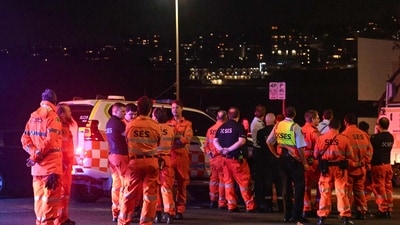 Emergency services workers gather at the scene after a shooting incident at Bondi Beach in Sydney on December 14, 2025. (AFP) Emergency services workers gather at the scene after a shooting incident at Bondi Beach in Sydney on December 14, 2025. (AFP)