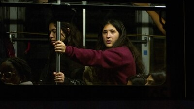 TOPSHOT - Brown University students are evacuated in a public bus after a mass shooting at the Barus & Holley building, home to the engineering and physics departments, in Providence, Rhode Island, on December 13, 2025. (Photo by Bing Guan / AFP) (AFP) TOPSHOT - Brown University students are evacuated in a public bus after a mass shooting at the Barus & Holley building, home to the engineering and physics departments, in Providence, Rhode Island, on December 13, 2025. (Photo by Bing Guan / AFP) (AFP)