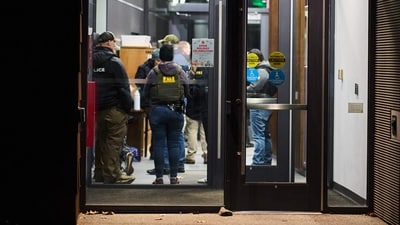Law enforcement officers gather inside Kassar House, home of the mathematics department, near the site of a mass shooting at Brown University campus in Providence, Rhode Island, on December 13, 2025. (Photo by Bing Guan / AFP) (AFP) Law enforcement officers gather inside Kassar House, home of the mathematics department, near the site of a mass shooting at Brown University campus in Providence, Rhode Island, on December 13, 2025. (Photo by Bing Guan / AFP) (AFP)