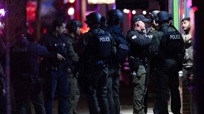 PROVIDENCE, RHODE ISLAND - DECEMBER 13: Police officers remain on the scene of a shooting that killed two and wounded many others at Brown University on December 13, 2025 in Providence, Rhode Island (Photo by Libby O'Neill / GETTY IMAGES NORTH AMERICA / Getty Images via AFP) (Getty Images via AFP) PROVIDENCE, RHODE ISLAND - DECEMBER 13: Police officers remain on the scene of a shooting that killed two and wounded many others at Brown University on December 13, 2025 in Providence, Rhode Island (Photo by Libby O'Neill / GETTY IMAGES NORTH AMERICA / Getty Images via AFP) (Getty Images via AFP)