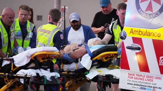 Emergency workers transport a person on a stretcher after a reported shooting at Bondi Beach in Sydney, Sunday, Dec. 14, 2025. (AP)