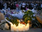 Mourners gather at a tribute at the Bondi Pavillion in memory of the victims of a shooting at Bondi Beach, in Sydney on December 15, 2025. 