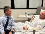 New South Wales Premier Chris Minns visits Ahmed al Ahmed, who was identified on social media as the bystander who hid behind parked cars and seized a rifle from one of the gunmen during the deadly shooting at Bondi Beach on Sunday.