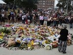 Bondi Beach shooting: People gather at a growing flower memorial to shooting victims outside the Bondi Pavilion at Sydney's Bondi Beach. Bondi Beach shooting: People gather at a growing flower memorial to shooting victims outside the Bondi Pavilion at Sydney's Bondi Beach.