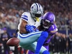 Minnesota Vikings cornerback Byron Murphy Jr., right, breaks up a pass intended for Dallas Cowboys wide receiver George Pickens