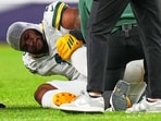 Green Bay Packers' Micah Parsons reacts after an injury during the second half of an NFL football game against the Denver Broncos, in Denver. Green Bay Packers' Micah Parsons reacts after an injury during the second half of an NFL football game against the Denver Broncos, in Denver.
