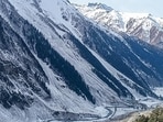 People walk along the Amarnath track as fresh snowfall blankets the area, in Baltal, on Sunday. (PTI) People walk along the Amarnath track as fresh snowfall blankets the area, in Baltal, on Sunday. (PTI)