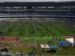 The angry crowd hurled water bottles at police personnel and allegedly tried to set some property on fire. Nets from the goalposts and chairs in the stands were ripped off (Samir Jana/ HT photo)
