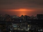 An explosion of a drone lights up the sky over Kyiv during a Russian attack on Saturday.