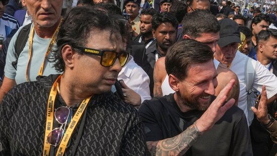 Lionel Messi, front right, organiser Satadru Datta, front left, and others during the 'G.O.A.T. India Tour 2025' event, at Vivekananda Yuba Bharati Krirangan (PTI)
