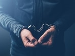 Arrested computer hacker and cyber criminal with handcuffs, close up of hands (Getty Images/iStockphoto) Arrested computer hacker and cyber criminal with handcuffs, close up of hands (Getty Images/iStockphoto)