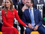 Donald Trump Jr. sits with his partner Bettina Anderson before a ceremony to present the Presidential Medal of Freedom for Charlie Kirk to his widow Erika Kirk in the Rose Garden of the White House, Tuesday, Oct. 14, 2025, in Washington. (AP Photo/Mark Schiefelbein)