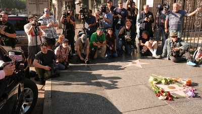 Media gathers at the Walk of Fame star for Rob Reiner Monday, Dec. 15, 2025, in the Hollywood section of Los Angeles. (AP Photo/Damian Dovarganes) (AP) Media gathers at the Walk of Fame star for Rob Reiner Monday, Dec. 15, 2025, in the Hollywood section of Los Angeles. (AP Photo/Damian Dovarganes) (AP)
