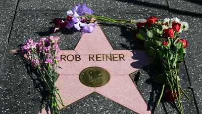Flowers are left at US actor and director Rob Reiner's Star on the Hollywood Walk of Fame in Los Angeles, California, on December 15, 2025 (Photo by Frederic J. Brown / AFP) (AFP) Flowers are left at US actor and director Rob Reiner's Star on the Hollywood Walk of Fame in Los Angeles, California, on December 15, 2025 (Photo by Frederic J. Brown / AFP) (AFP)